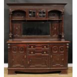 A Jacobean Revival oak sideboard, outswept cornice above a pair of doors and a bevelled