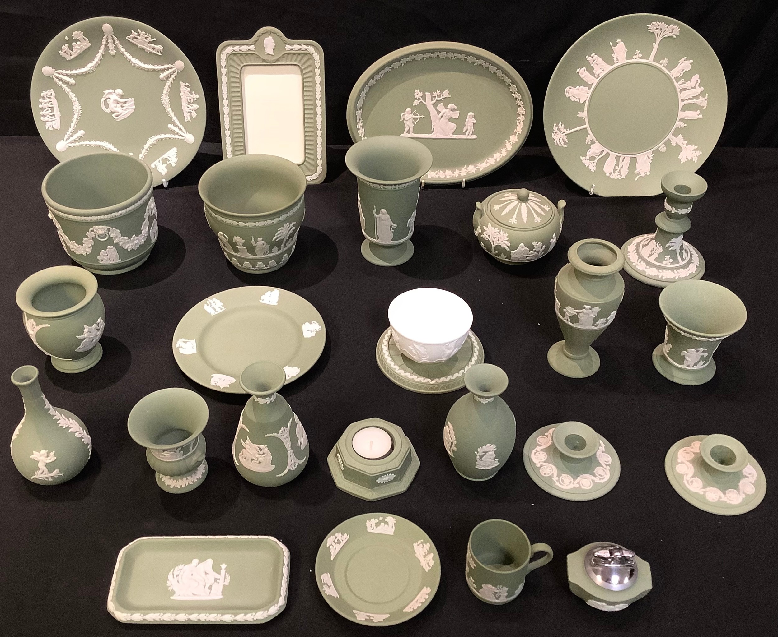 Wedgwood green jasperware including various vases, candlesticks, jardinieres, photograph frame,