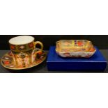 A Royal Crown Derby Imari palette 1128 pattern coffee can and saucer, solid gold band, second; an