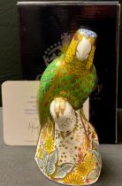 A Royal Crown Derby paperweight, Amazon Green Parrot, limited edition 1,202/2,500, gold stopper,