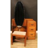 An Art Deco oak and veneer vanity dressing station, the bevelled oval cheval form mirror above a