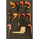 A collection of tobacco pipes including silver mounted calabash, briar, clay, etc