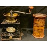 A Victorian boxwood spice tower, clove, mace and nutmeg; a Victorian brass and iron coffee