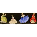 A Royal Doulton figure, Daydreams HN1731; three others, Top O'The Hill HN1834, Buttercup HN2309,