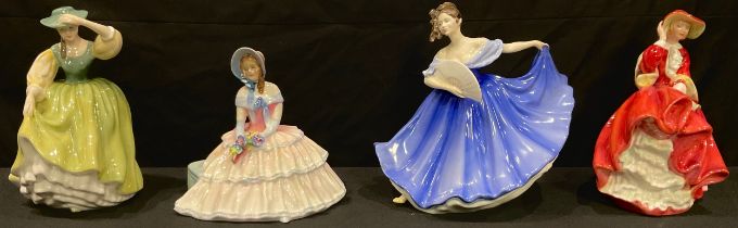 A Royal Doulton figure, Daydreams HN1731; three others, Top O'The Hill HN1834, Buttercup HN2309,