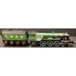 A reproduction Flying Scotsman LNER 4-6-2 tinplate locomotive and eight wheel tender, no.4472