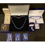 A lapis lazuli necklace, boxed; another with ovoid polished lapis lazuli beads, boxed; a