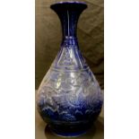 A Chinese export ware stoneware baluster vase, moulded in relief with mythical Qilin and griffin,