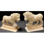 A pair of alabaster library desk models, carved in the Grand Tour taste after the Medici Lions,