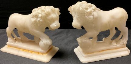 A pair of alabaster library desk models, carved in the Grand Tour taste after the Medici Lions,