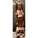 A Chinese hardwood carving of Guanyin, 46cm high