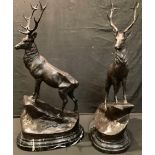 After Jules Moigniez, a pair of bronzed metal stags, modelled on a naturalistic rocky outcrop,