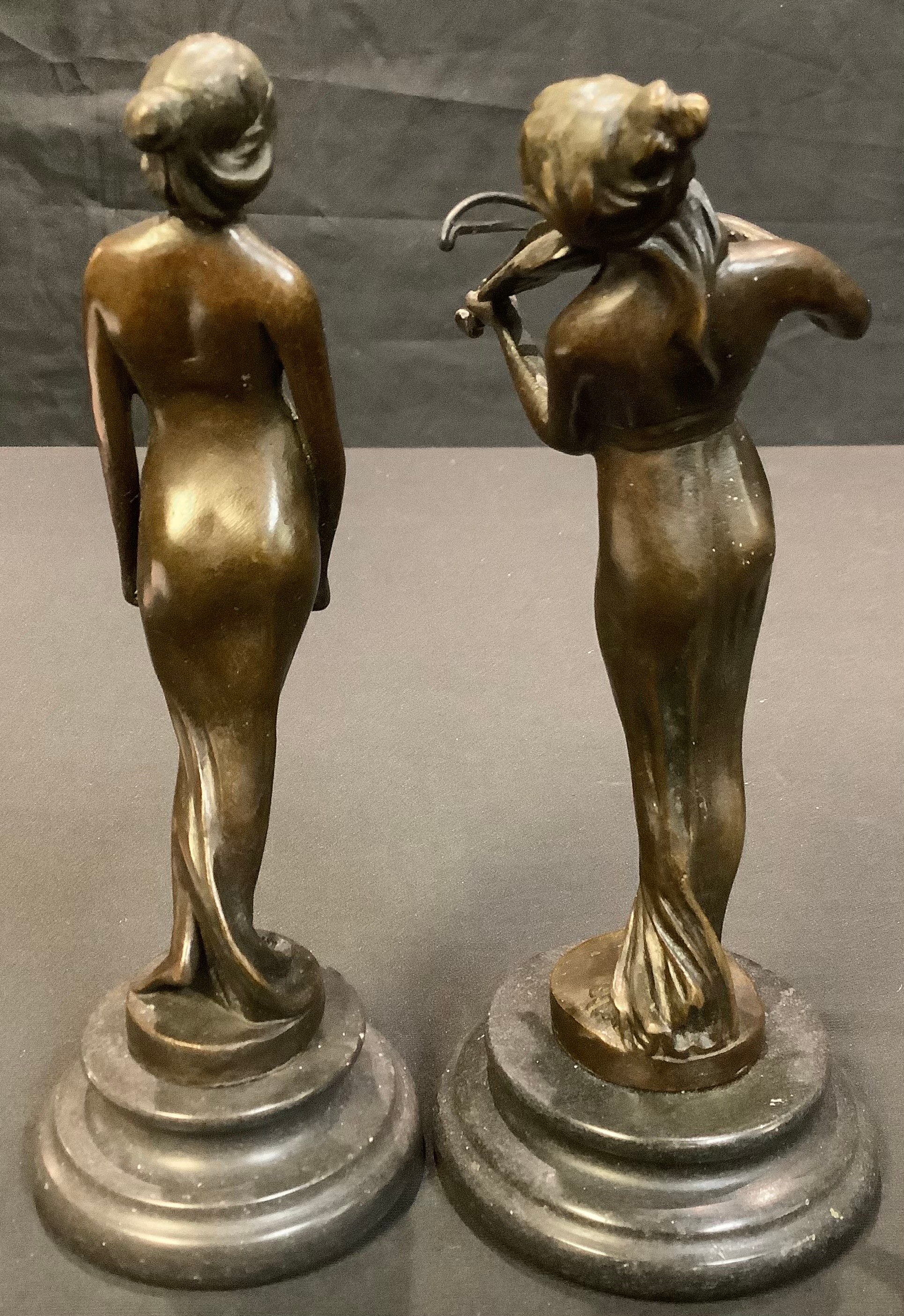 A dark patinated bronze figure, of a lady playing a violin; another of a lady holding a tray, each - Image 2 of 2