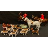 A Beswick huntsman on rearing bay horse, number 868, printed mark in black; another huntsman on a