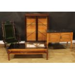 An early 20th century American spring rocking chair, 102cm high, 57.5cm wide, the seat 43cm wide and