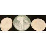 An Art Nouveau green jasperware circular plaque, decorated with scantily clad classical maiden, 17.