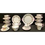 A Shelley tea service for six, decorated with blossom and fruit, comprising cake plate, cream jug,