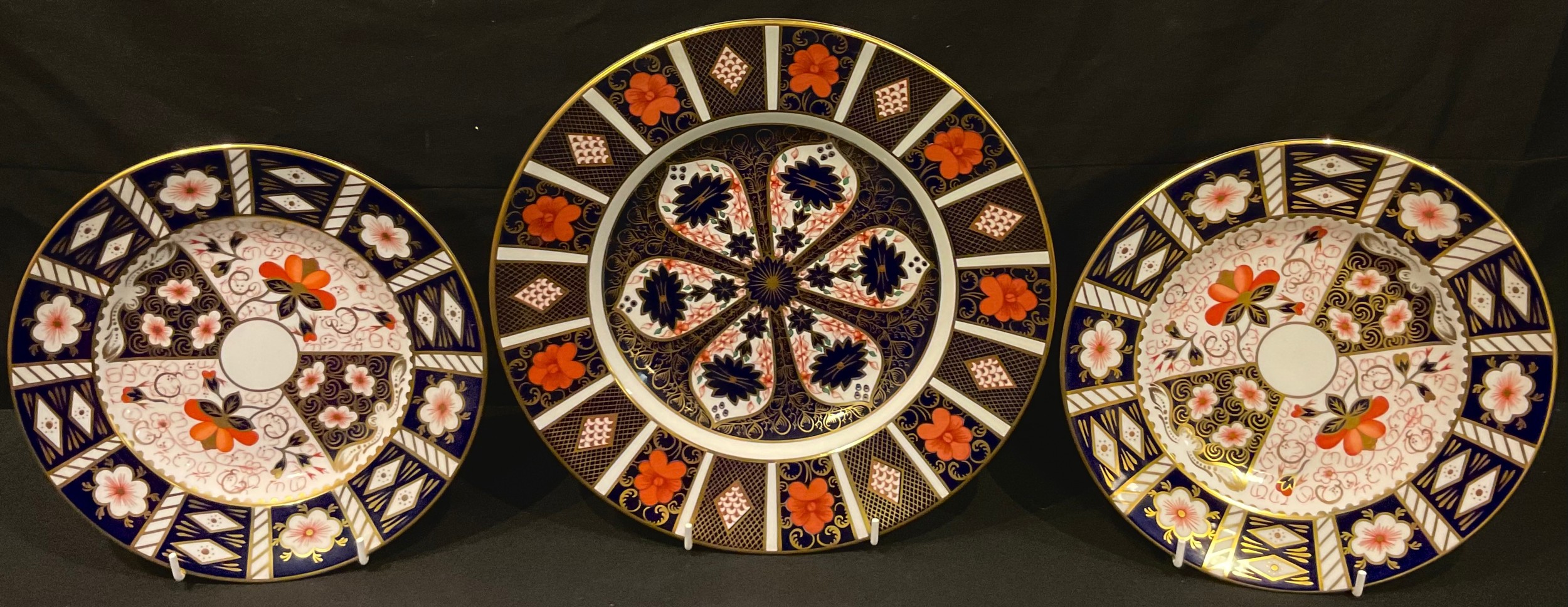 A Royal Crown Derby Imari palette 1128 pattern dinner plate, second; a pair of 2451 side plates,