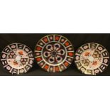A Royal Crown Derby Imari palette 1128 pattern dinner plate, second; a pair of 2451 side plates,