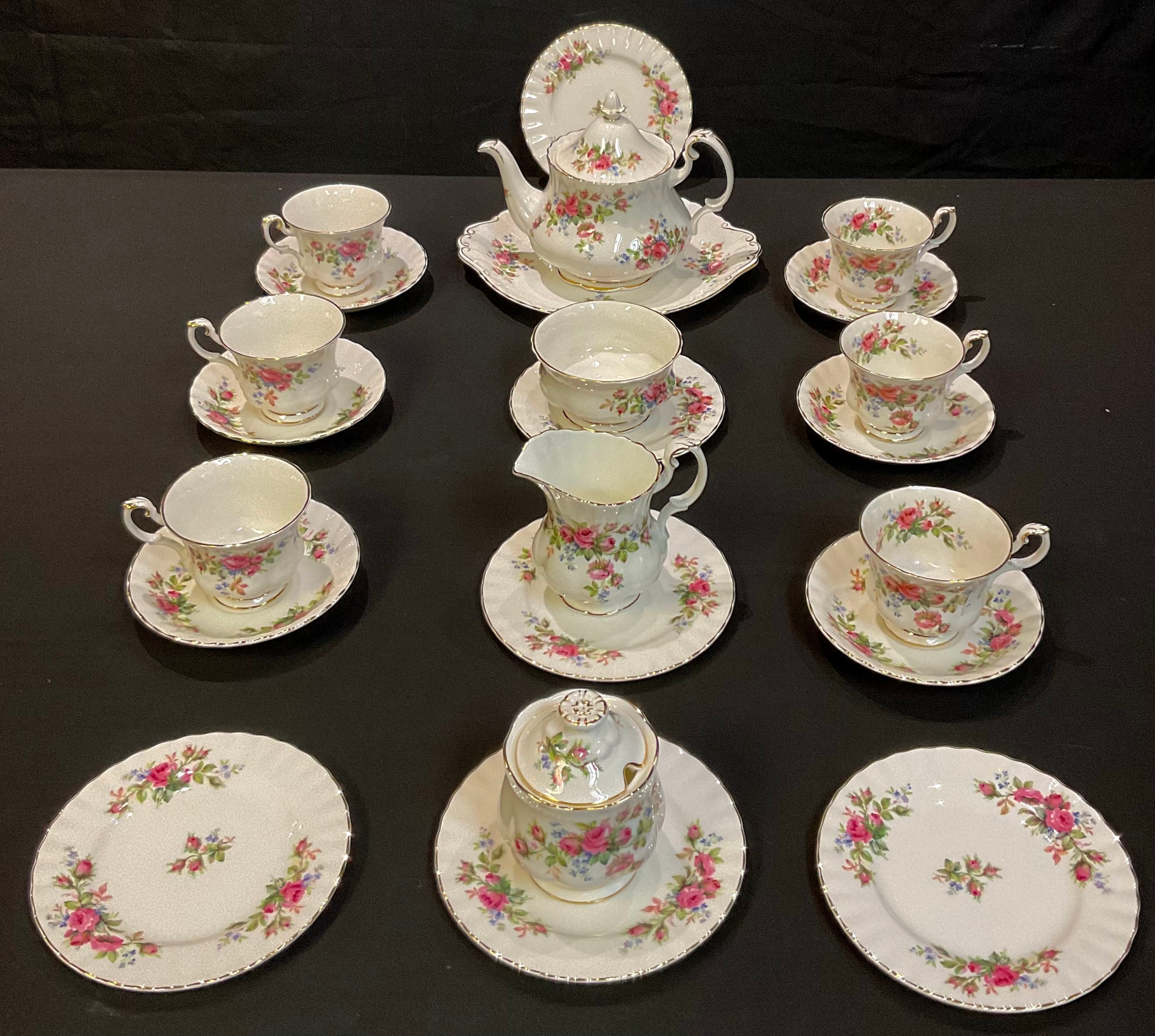 A Royal Albert Moss Rose tea service for six comprising teapot, cream jug, sucrier, cake plate, side