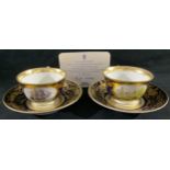 A pair of Royal Crown Derby teacups and saucers, HMS Victory Cabinet Cups and Saucers, Peter Jones