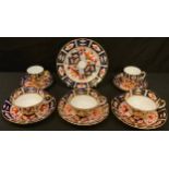 A Royal Crown Derby Imari palette 2451 pattern tea cup, saucer and tea plate, two teacups and