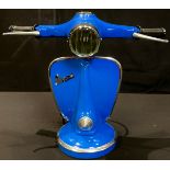 A novelty table lamp, modelled as a Vespa handlebar and front panel, 33.5cm high, 41cm wide