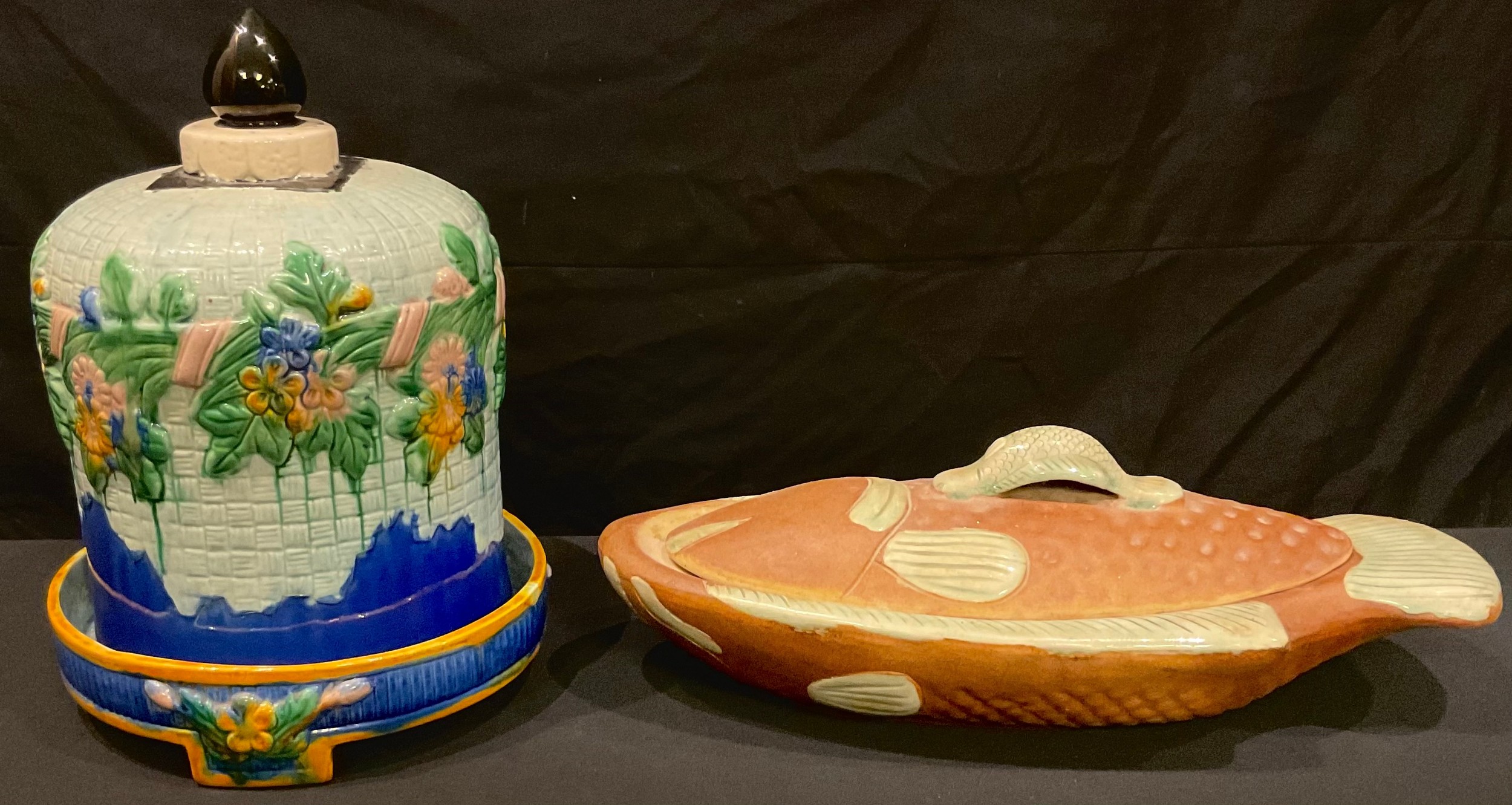 A majolica cheese dome; a stoneware fish dish and cover (2)