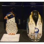 A Royal Crown Derby paperweight, Rock Hopper Penguin, 21st anniversary gold stopper, certificate,