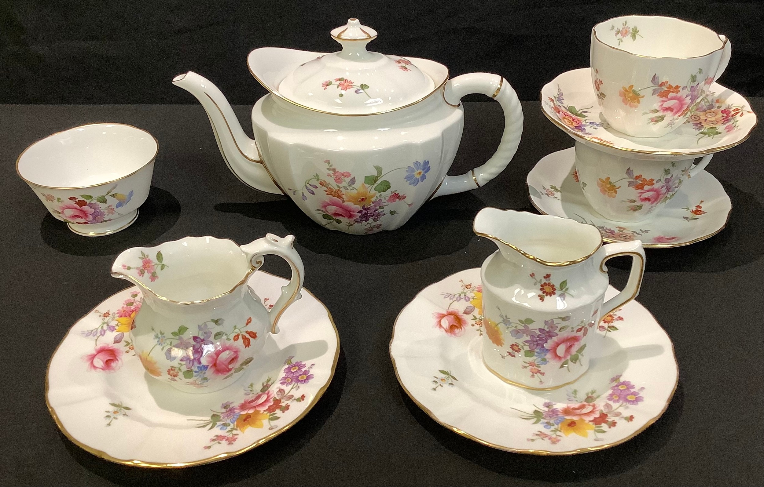 A Royal Crown Derby Posie pattern tea for two comprising, teapot, pair of cups, saucers and tea