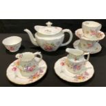A Royal Crown Derby Posie pattern tea for two comprising, teapot, pair of cups, saucers and tea