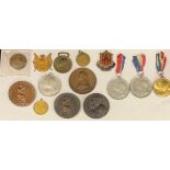 A bronze Nelson Trafalgar medallion; three bronze medallions; Coronation medallions; etc