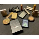 A collection of cigarette lighters, including WWI German'Gott Mit Uns', bullet shaped Trench Art