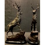 A pair of bronzed stags, after J Moigniez, each stood upon a rocky outcrop, 43cm high (2)