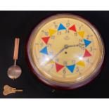 A reproduction RAF fusee wall clock, 32cm diameter dial, 38cm diameter overall, with key and