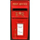 A replica ERII Post Office post box, painted in red, 56.5cm high, 24cm wide, 37.5cm deep