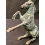 After the antique, a Verdigris patinated bronze rearing horse, 22cm high