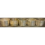 Military Interest - RAF - a set of five silver plated Air Ministry mess napkin rings, crowned AM