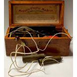 An early 20th century electric shock machine, Magneto-Electric, stained pine box
