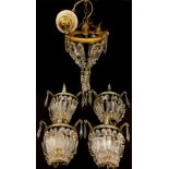 A set if four gilt meatl and clear glass wall lights, prismatic and facetted lustres, 21cm high; etc
