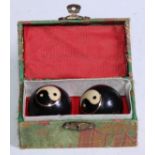 A pair of yin and yang Baoding balls, boxed