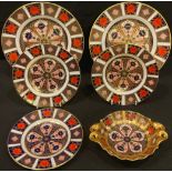 A pair of Royal Crown Derby Imari palette 1128 pattern side plates, seconds; three tea plates, one