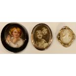 A Continental porcelain oval brooch, painted with young boy; a cameo brooch; an oval photograph