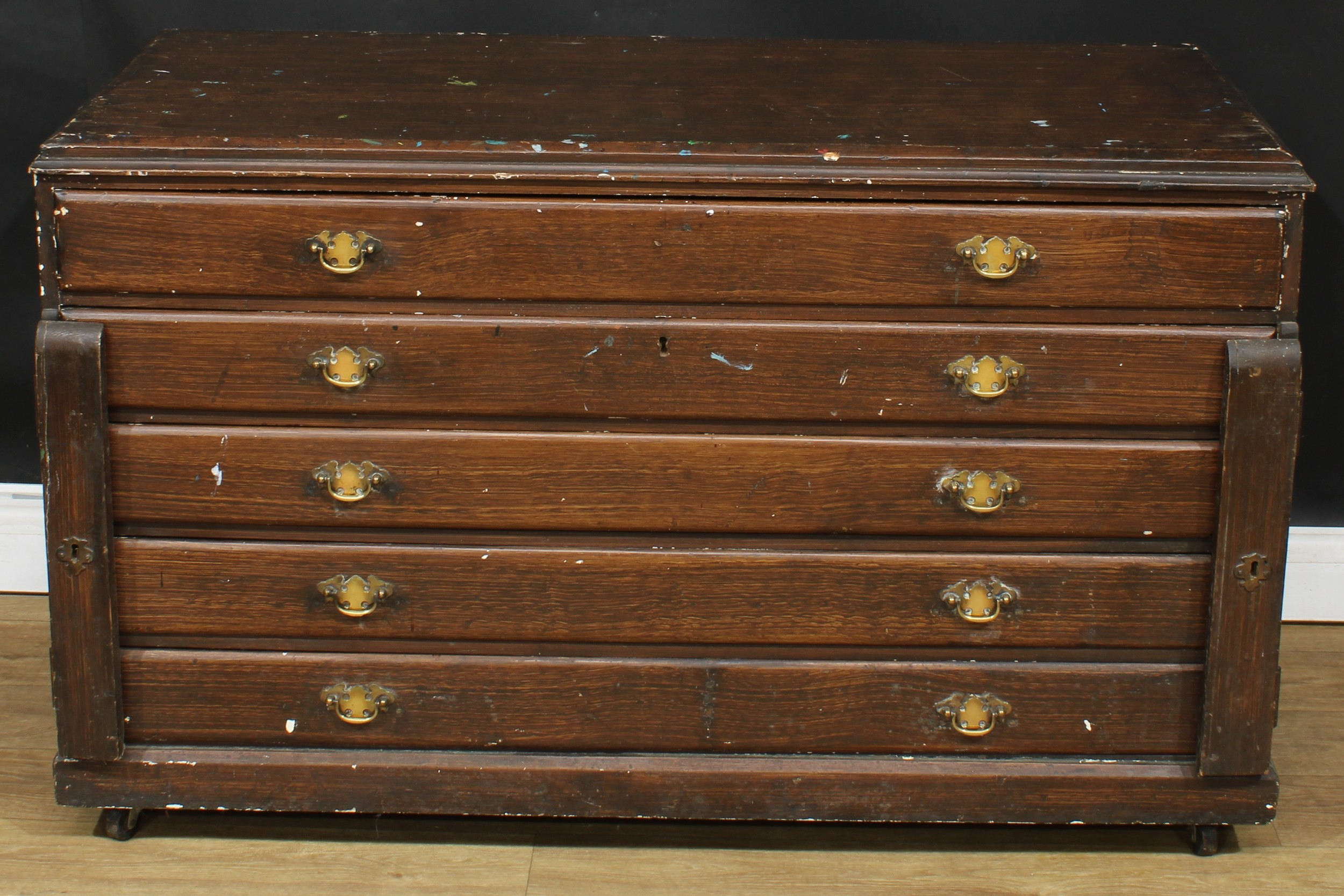 A scumbled pine plan chest, rectangular top above five long drawers, 74.5cm high, 123.5cm wide, 58cm