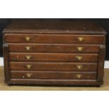 A scumbled pine plan chest, rectangular top above five long drawers, 74.5cm high, 123.5cm wide, 58cm