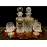 A cut glass decanter, another, three brandy balloons, three silver plated labels Whisky, Sherry