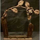 An Arts and Crafts wrought iron photograph frame, early 20th century