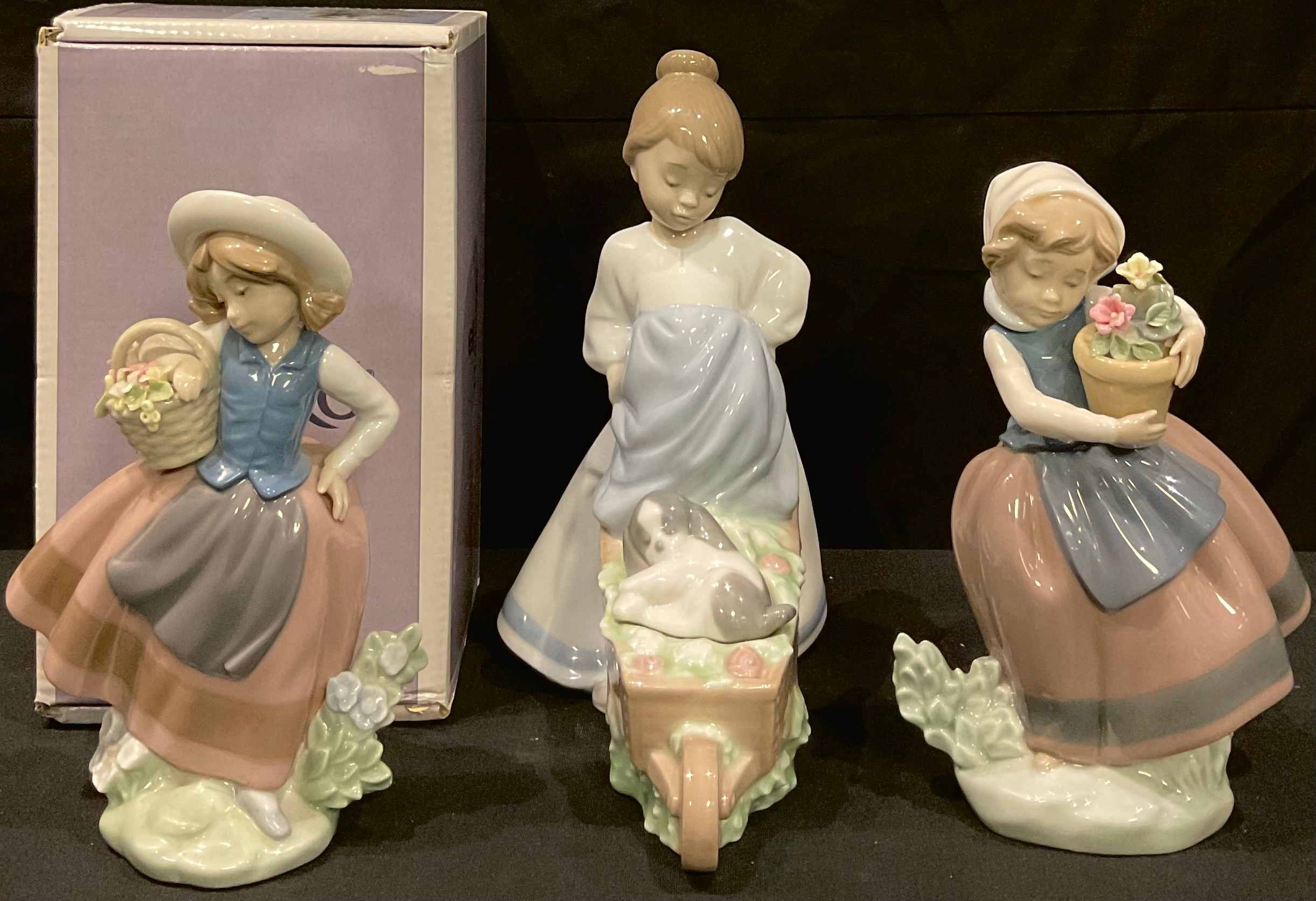 A Lladro figure, Sweet Scent, designed by Jose Puche, number 5221, 16cm, boxed; others, Spring is