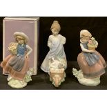 A Lladro figure, Sweet Scent, designed by Jose Puche, number 5221, 16cm, boxed; others, Spring is