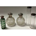 A matched pair of Edwardian silver and cut glass globular scent bottles, hobnail cut, Birmingham